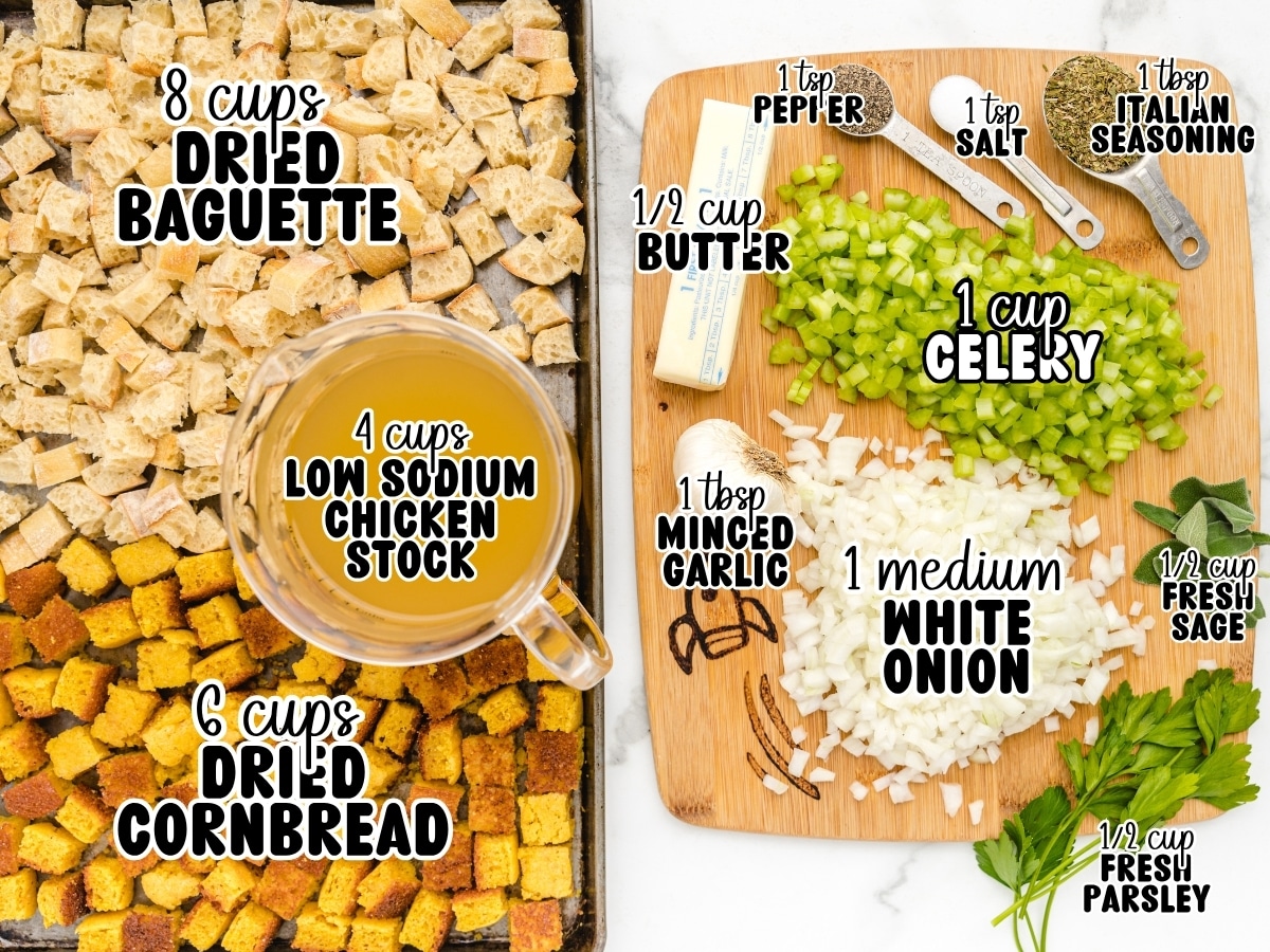 Overhead ingredient layout for Cornbread Stuffing showing 8 cups dried baguette, 6 cups dried cornbread, 4 cups low-sodium chicken stock, ½ cup butter, 1 cup celery, 1 medium white onion, 1 tablespoon minced garlic, ½ cup fresh sage, ½ cup fresh parsley, 1 tablespoon Italian seasoning, 1 teaspoon salt, and 1 teaspoon pepper.